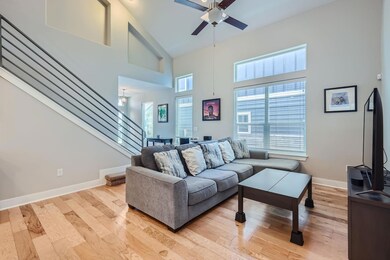 Living area with high vaulted ceiling, ceiling fa
