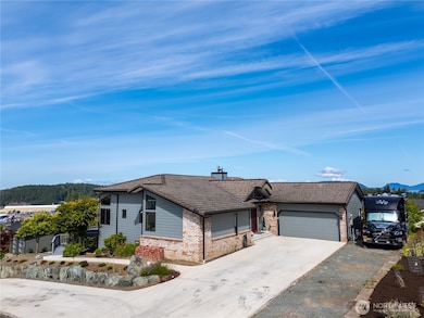Wonderful curb appeal shows the abundance of parking. RV is connected to power and sewer.