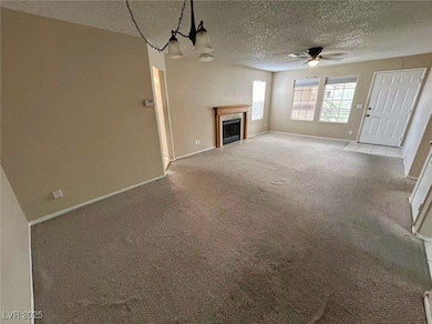 Unfurnished living room with a ceiling fan, a text