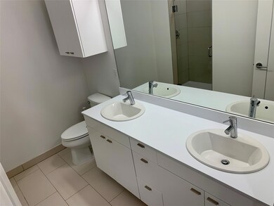 Full bathroom with a stall shower, double vanity,