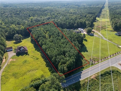 Aerial view of property's location featuring property parcel outlined