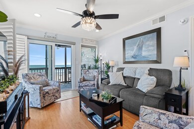 Living room with visible vents, a water view, ceil