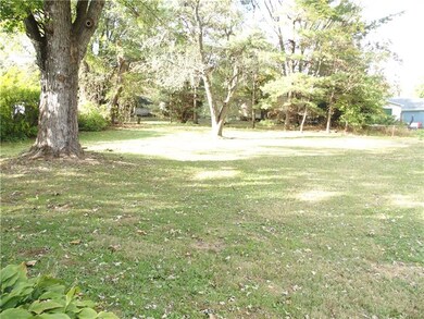 This back yard has room for a garden, toys, garage