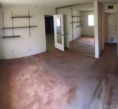 Downstairs bedroom with adjacent full bathroom