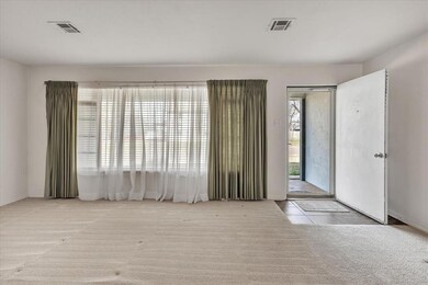 View of carpeted entrance foyer