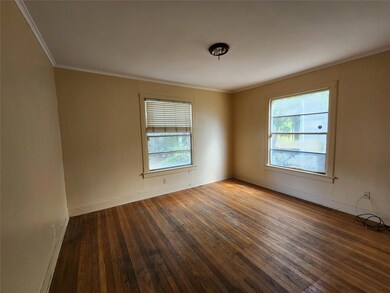 Spare room with dark hardwood / wood-style floorin