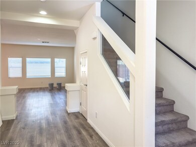 Stairway featuring wood finished floors, recessed