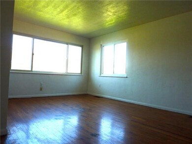 Large living room with bay window.