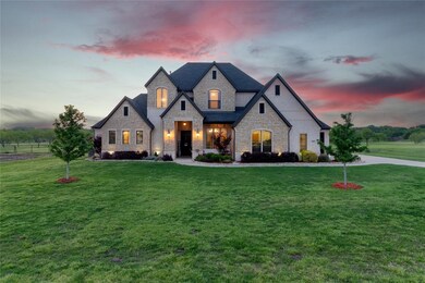STUNNING curb appeal welcomes you to the secluded Poetry Ranch!