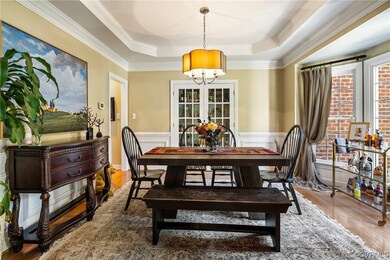Wood floored dining area with plenty of natural li