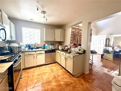 Kitchen with appliances with stainless steel finis