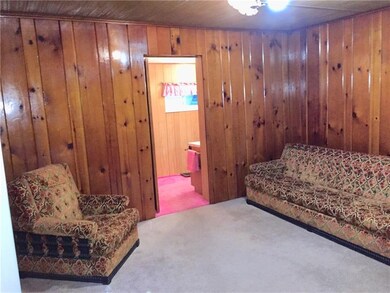 Gleaming oak wood paneled walls in the Living room