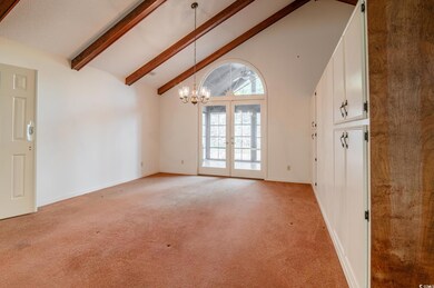 Living Room to Dining Room featuring beamed ceilin