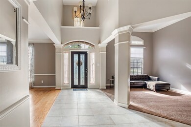 View from living room shows a high-ceilinged front