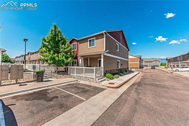 View of front of property featuring a residential view, uncovered parking, and stone siding