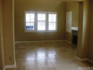 Living Room w/ fireplace and shutters