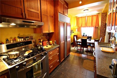 Cherry cabinets, stainless steel appliances and a