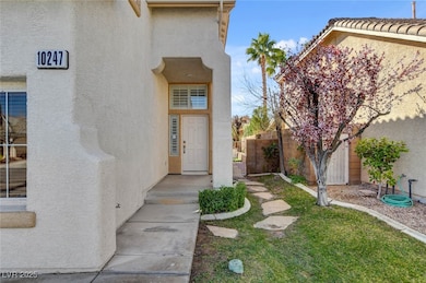 Doorway to property featuring fence and stucco sid