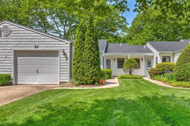 Ranch-style home with concrete driveway, a garage, a front yard, and a shingled roof