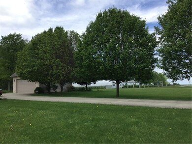 Mature landscaping and tree lined double wide ceme