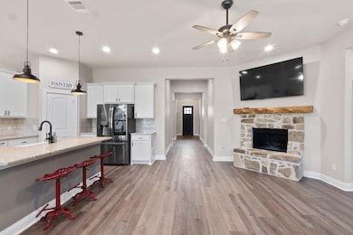 Kitchen featuring stainless steel refrigerator wit