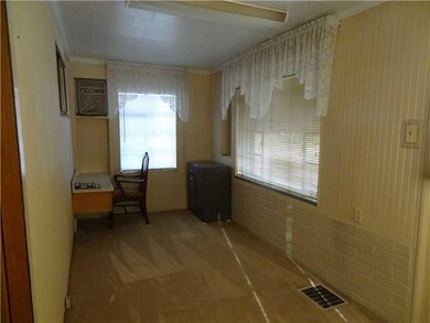 Den. This room could be a den, computer room, or p