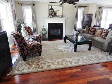Living Room. Beautiful cherry hardwoods and a gas