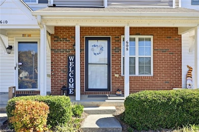 Front with brick & covered front porch