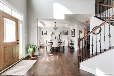 Hardwood floored foyer with natural light