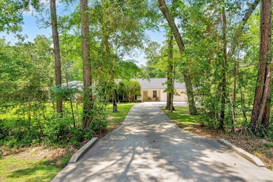 This property is lined with a perimeter of trees and woods for privacy and just look at that incredible entrance!