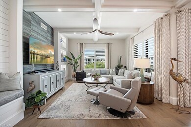 Living room with coffered ceiling, ceiling fan, be