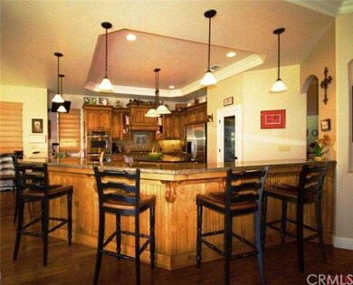Gourmet kitchen with ample bar seating, granite co