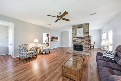 This spacious living area features light wood floo