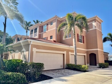 View of front of home with driveway, stucco siding