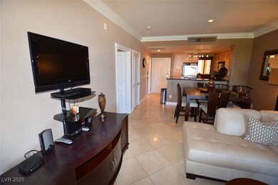 Living area with visible vents, light tile pattern