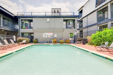 Community pool with a patio