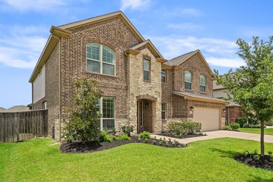 This home features beautiful stone and brick exterior, offering great street appeal.