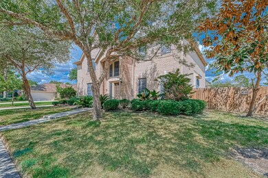 Large grassy front yard and mature landscaping