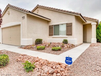 Welcoming walk-way leads to covered entry.