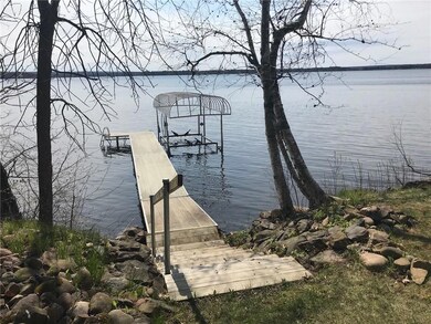 level lake frontage with a few steps to dock and lift