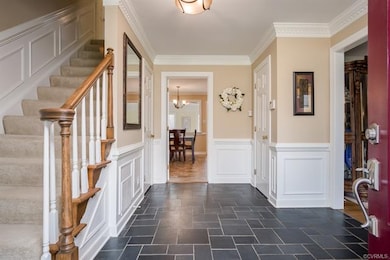 Stunning Foyer with slate floowing, crown, dentil,