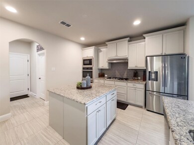 Modern kitchen equipped with a double oven and sta