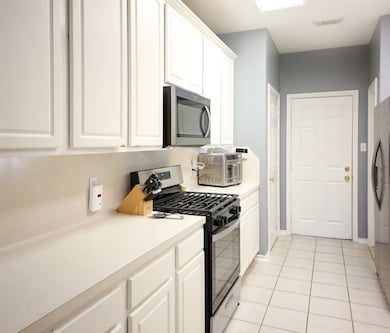 Galley kitchen with double pantries