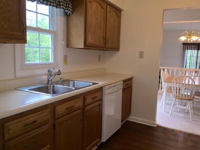 The wood flooring coordinates well with the kitche