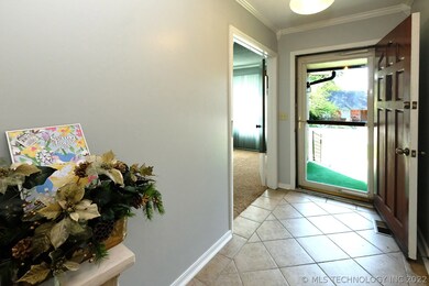 Tiled front entrance, large flex room off front en