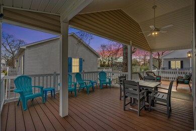 Wooden terrace with outdoor dining space and a cei