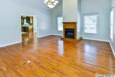 Includes vaulted ceiling, hardwood flooring, fireplace, ceiling fan and new paint