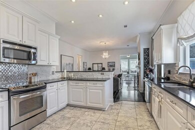 Spacious kitchen with granite counter tops with up