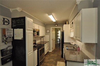 Kitchen with granite counters and stainless steel 