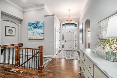 Inviting entry with spacious extra wide staircase 
